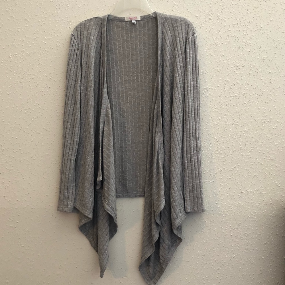 Ribbed light weight cream color cardigan.